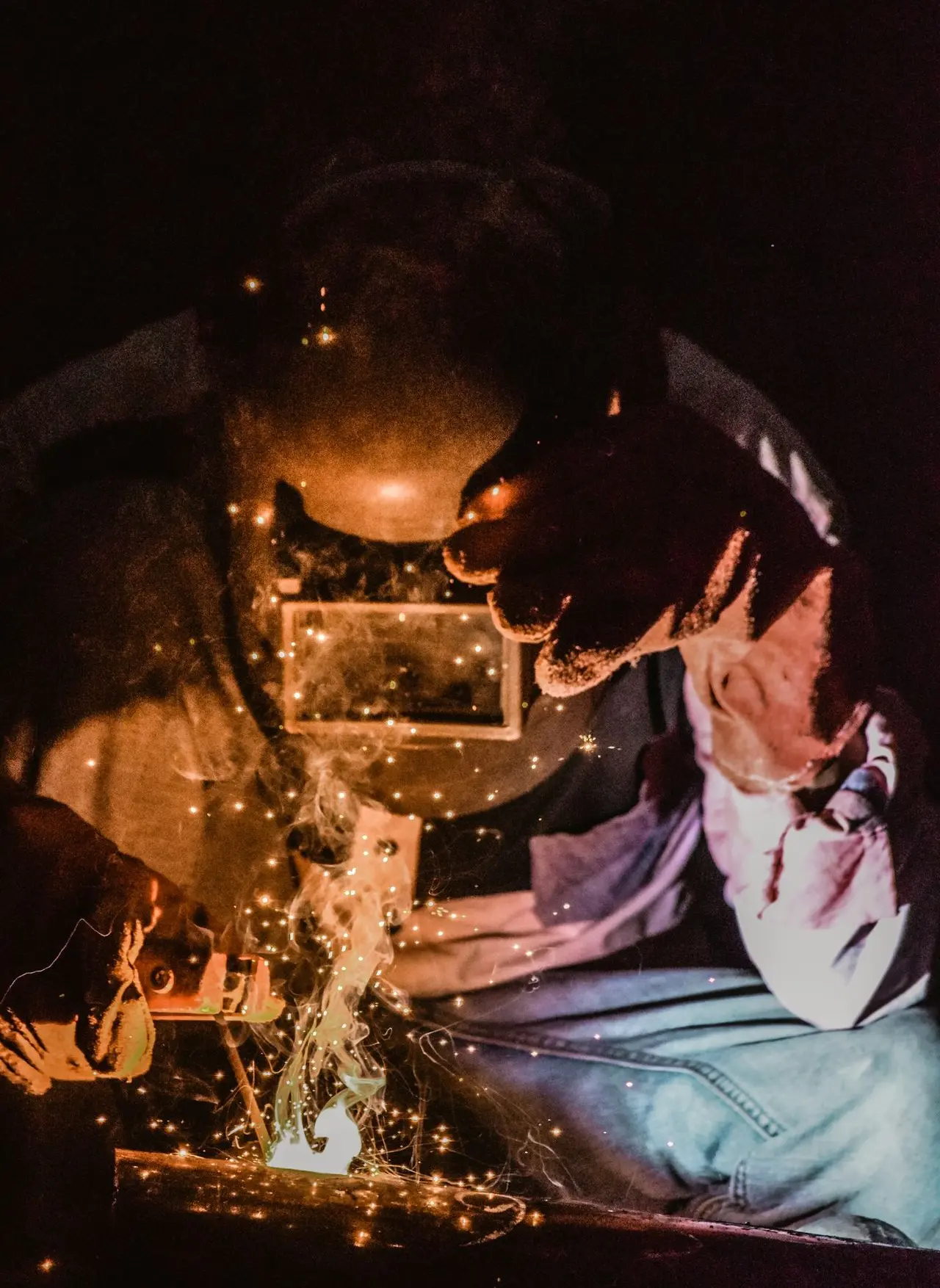 person welding metal